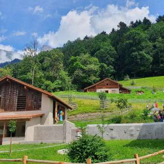 The Barn with Heidi’s Alp Cottage in the background © Heididorf