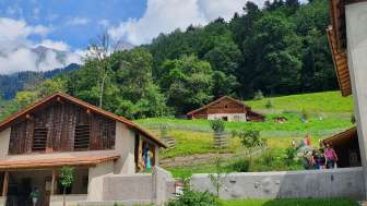 The Barn with Heidi’s Alp Cottage in the background © Heididorf